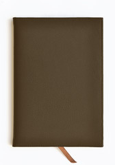 Dark brown leather notebook on white background