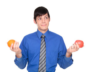 Caucasian businessman comparing apple to orange