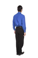 Caucasian businessman standing with arms at sides rear view