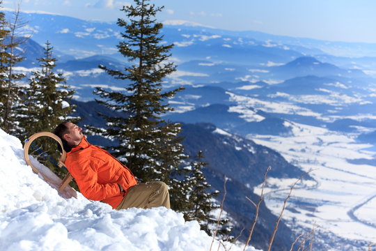 Man relaxing in snow