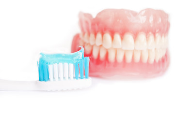 Tooth paste and denture