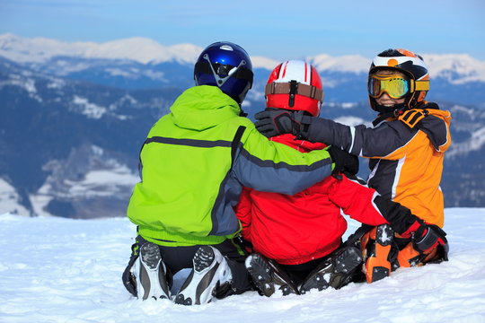 Kids on mountaintop snow