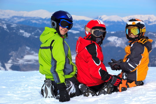 Child skiers on snowy mountain