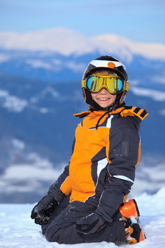 Young skier on snowy mountain