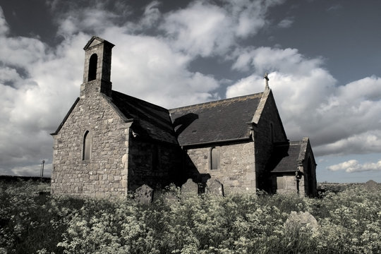 Nostalgic remote church in graveyard