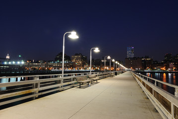 Fototapeta na wymiar A Long Pier at Night