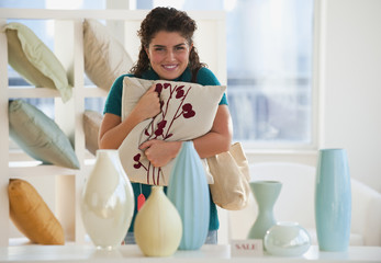 Mixed race woman shopping for pillows