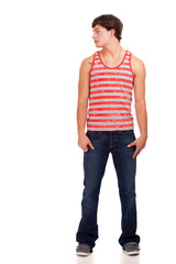 Obraz premium Young man in red and white striped shirt and jeans.