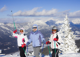 Skiers mountains in the background