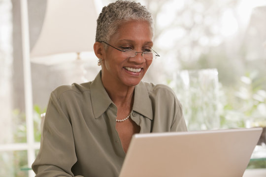 Black woman working on laptop