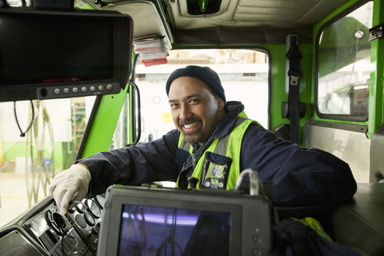 Pacific Islander Man Driving Garbage Truck