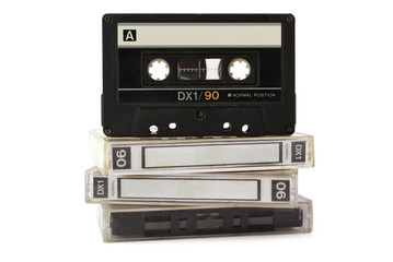 Audio cassette on three boxes isolated on white background