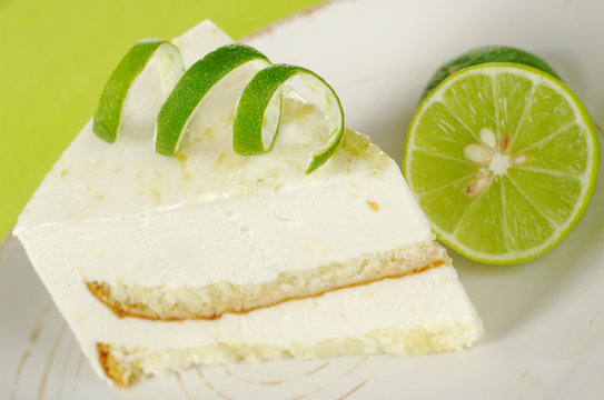 Lime cake with lime on a plate (Selective Focus)