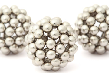 three balls of metal segment assembled from neocube isolated