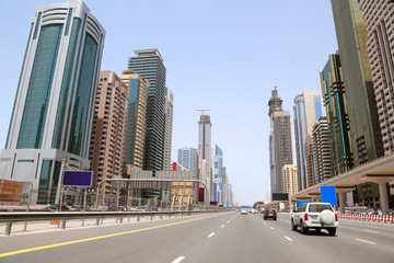 general view on trunk road and skyscrapers