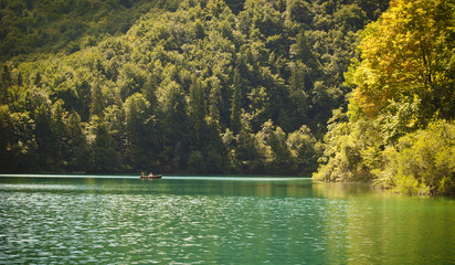 Romantic lake scene with a couple in a row boat