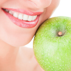 healthy teeth and green apple