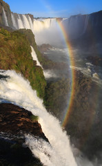 Igaucu falls with rainbow and rocks portrsit
