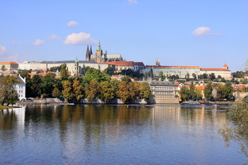 Fototapeta na wymiar The View on autumn Prague gothic Castle above River Vltava