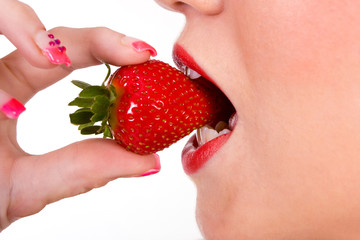 woman eating strawberry