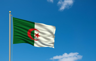 Flag of Algeria waving in the wind in front of blue sky