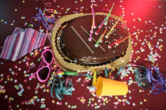 Chocolate Holiday Party Cake On A Messy Table