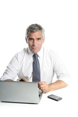 businessman senior gray hair working laptop