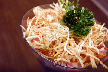 Salad with crunchy potato in glass