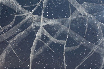 Spider web of tension cracks in thick layer of ice