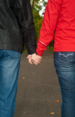 Young Man and woman holding hands