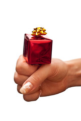 Red gift box on woman's hand