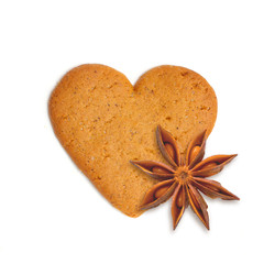 heart shape xmas cake with spice anis isolated on white backgrou