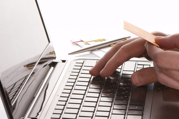 Men hands on keyboard of laptop