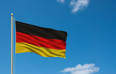 Flag of Germany waving in the wind in front of blue sky