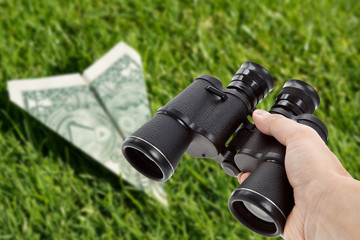 Binoculars and dollar