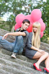 young loving couple on natural background