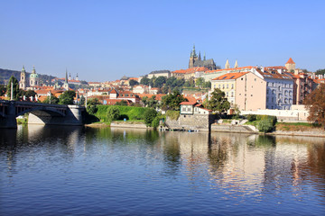 Fototapeta na wymiar The View on the autumn Prague gothic Castle above River Vltava