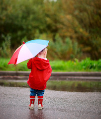 Toddler girl with umbrella