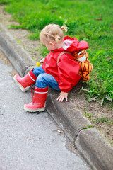 Toddler girl outdoor at rainy day