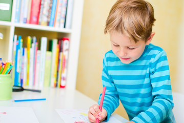 Portrait of happy schoolkid at home