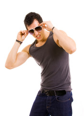 Portrait of stylished young man wearing sunglasses on white back