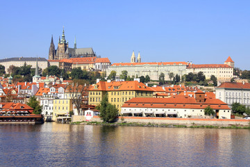 Naklejka na ściany i meble The View on the autumn Prague gothic Castle above River Vltava