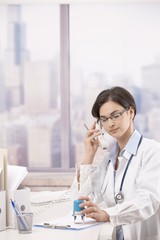 Female doctor talking on phone