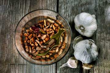 Borlotti beans and garlic on bare boards