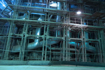 Equipment, cables and piping as found inside of a modern industr