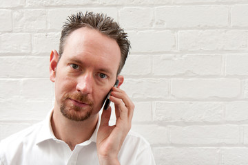 White Shirt Man on Phone