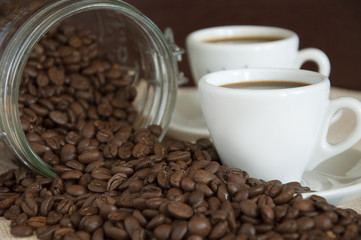 cup of coffee with coffee seeds