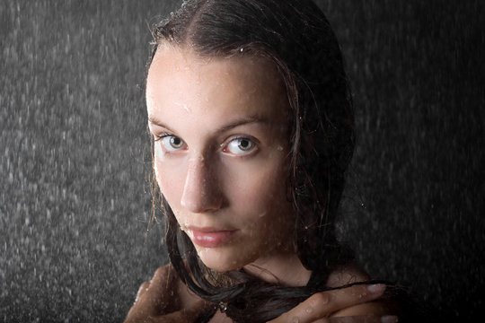 closeup portrait of attractive teen girl in water studio