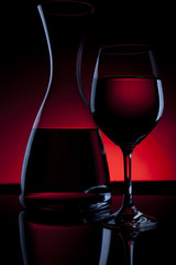 Wine Carafe and Glass on Red