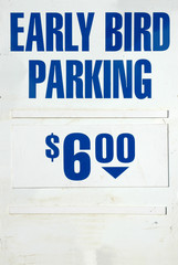 Obraz premium Weathered Early Bird Parking Sign With Blue Text